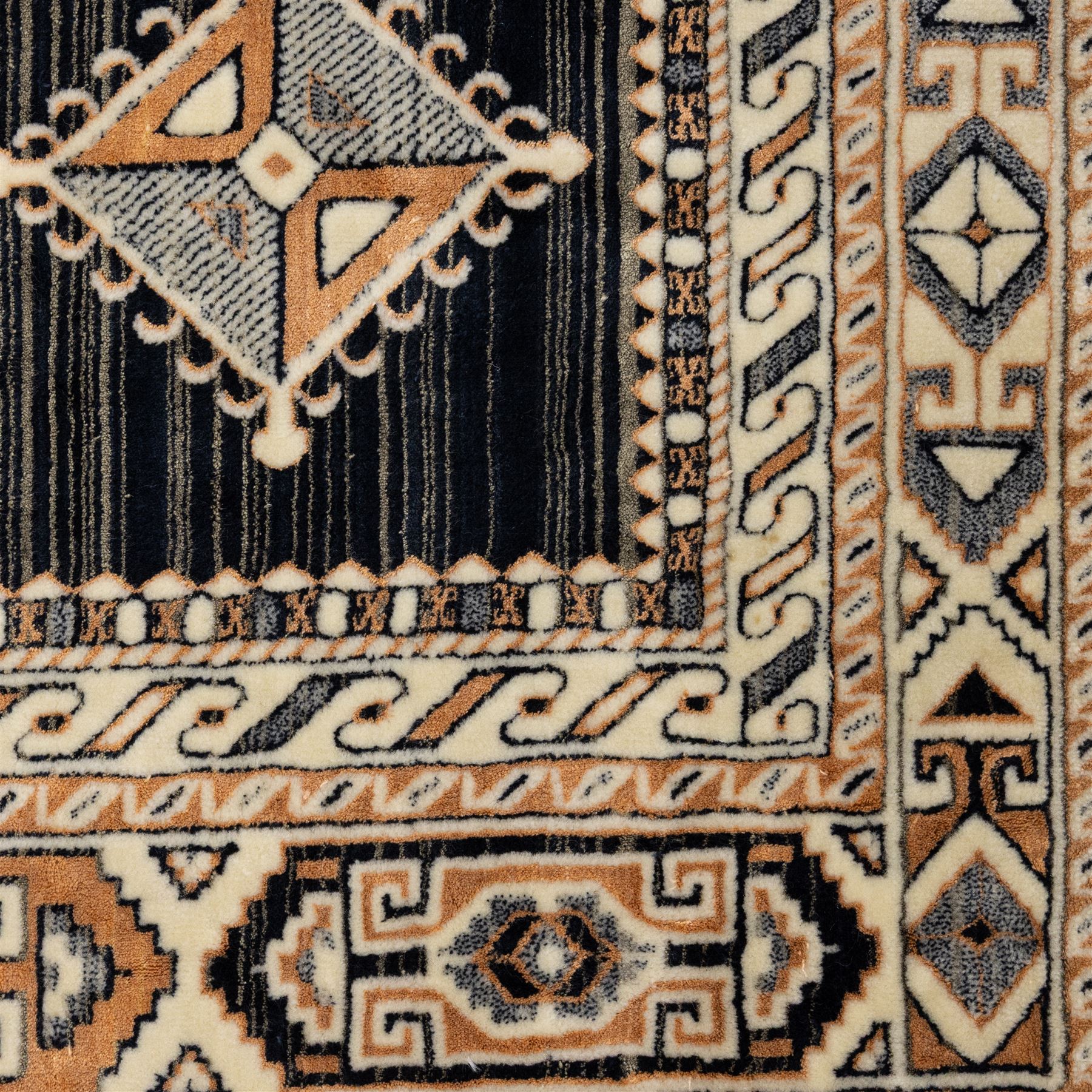 Two rugs, small Bokhara-type rug, terracotta ground with repeating hooked lozenge medallions enclosed by geometric borders (H 120cm, W 83cm); and a cream-ground rug, central lozenge medallion with geometric spandrels and border motifs (H 145cm, W 101cm),