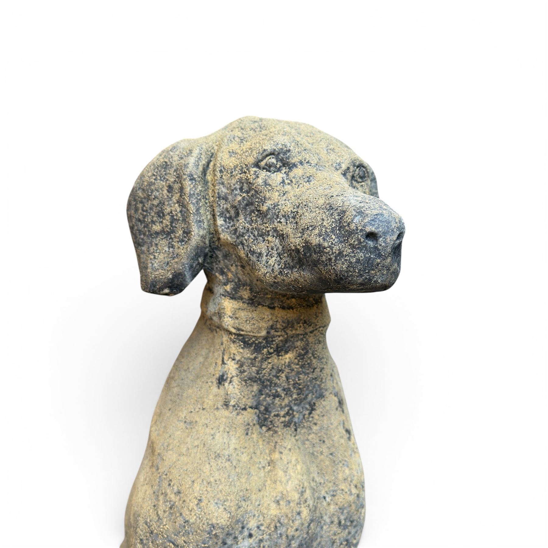 Pair of cast stone hunting pointer dogs in seated poses raised on rectangular bases, in antique weathered finish