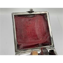 Edwardian silver mounted playing card case, hallmarked William Harrison Walter, Birmingham 1903, the sides each with a period playing card set behind a bevelled glass panel, the hinged cover with later engraving 'Presented to Norman T Crombie Esq by the officers & men of the 31st WR Detachment for services rendered 1917-1918', with red leather lined interior, the three compartments upon a sprung base and containing two later wooden Whist markers, case H12.5cm