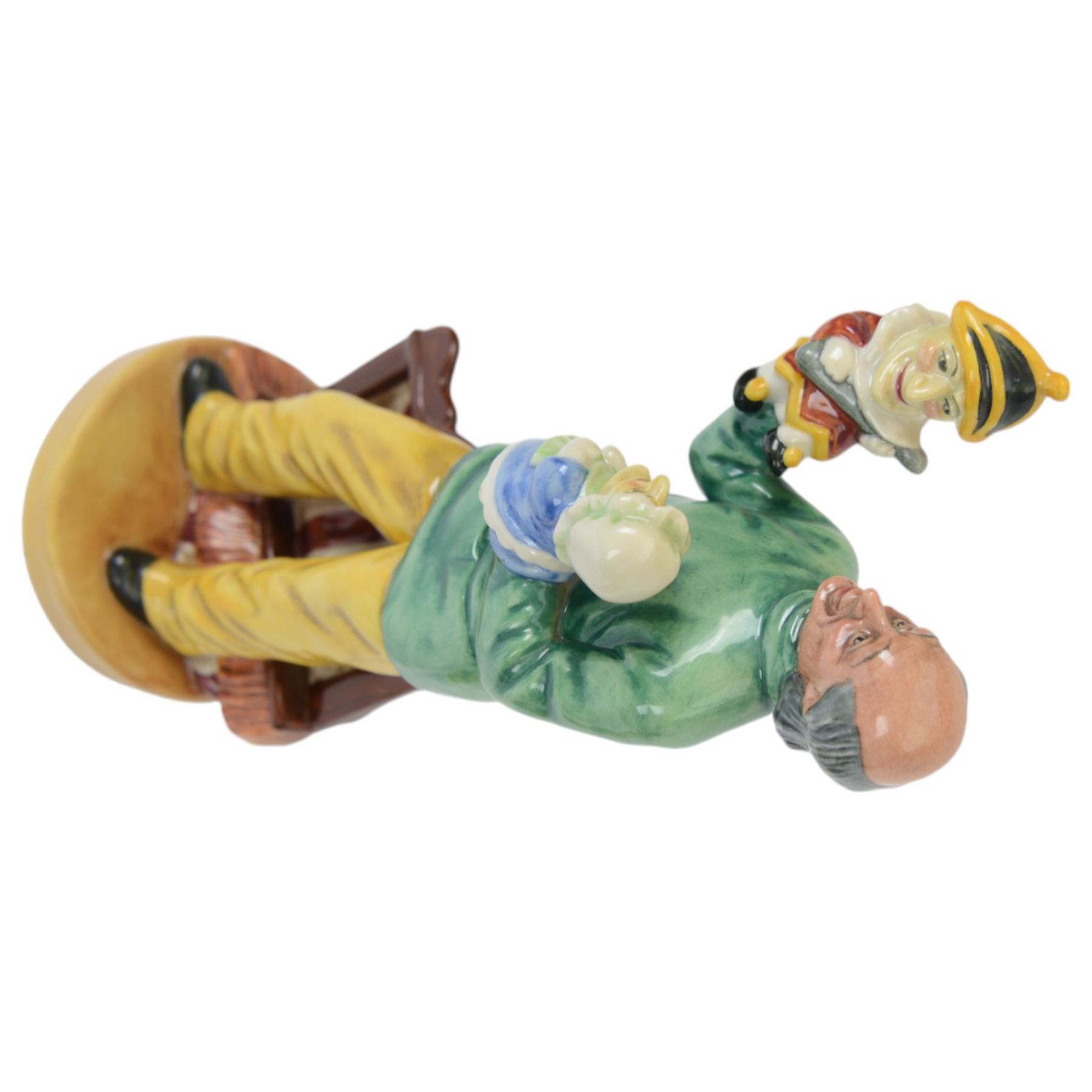 Four Royal Doulton figures, comprising The Judge HN2443, The Lawyer HN3041, Punch and Judy Man HN2765 and HN2016 