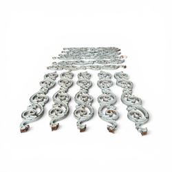 Set of eleven 19th century cast iron ornate stair or banister spindle supports, of scrolling form with scalloped decoration and flower-head motifs, in weathered duck-egg blue painted finish (11)