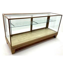 Mid century oak framed glazed display counter, two sliding doors, glazed shelves W182cm, H91cm, D61cm