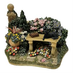 Four Lilliput Lane models, from the Secret Gardens collection, comprising Nature's Doorway, Fruits of Eden, Picnic Paradise and Peaceful Pastimes, all boxed 