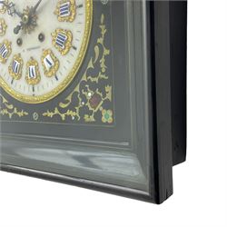 Auguste GP. Andhomme - French vineyard clock,  late 19th century 8-day twin train spring driven wall clock with enamelled and inlaid brass decoration within an ebonised and glazed case, circular enamel dial with cartouche Roman numerals, minute markers, pieced steel hands and a chased brass slip, striking movement, sounding the hours and half hours on a coiled gong. With pendulum and key.  
