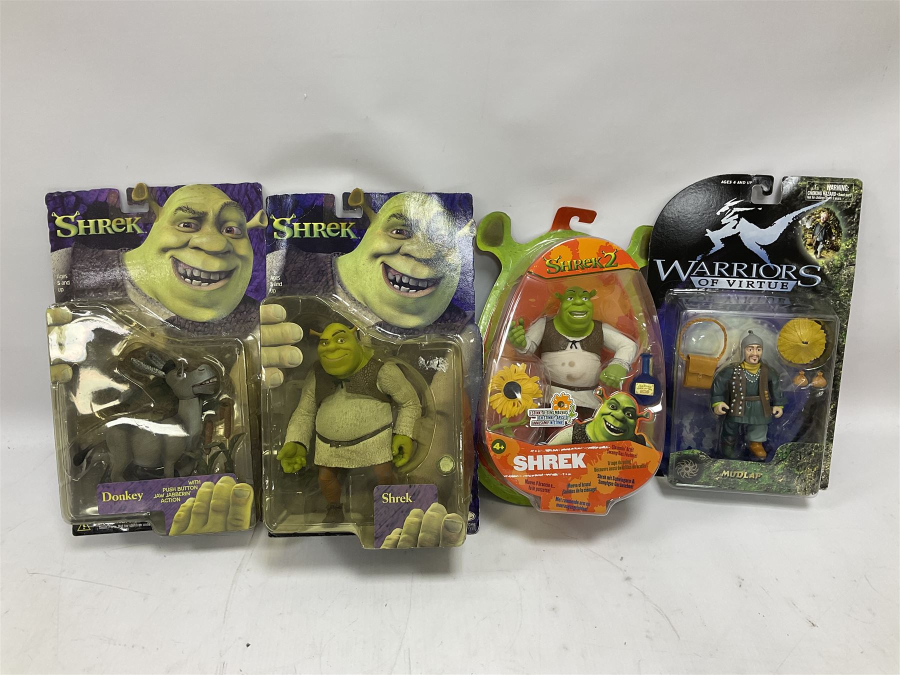Seventeen TV & film related carded action figures comprising four Pirates of the Caribbean; five Shrek; three Star Trek; two Sea Quest DSV; Captain Scarlet, Warriors of Virtue; and Jurassic World; all in unopened blister packs (17)