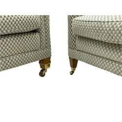 Three-piece hardwood-framed lounge suite - large two-seat Knole sofa with drop ends, upholstered in patterned fabric decorated with urns and foliage (W190cm, D117cm, H88cm); armchair upholstered in contrasting geometric pattern fabric (W83cm, D102cm, H93cm); and another armchair (W82cm, D102cm, H92cm) (3)