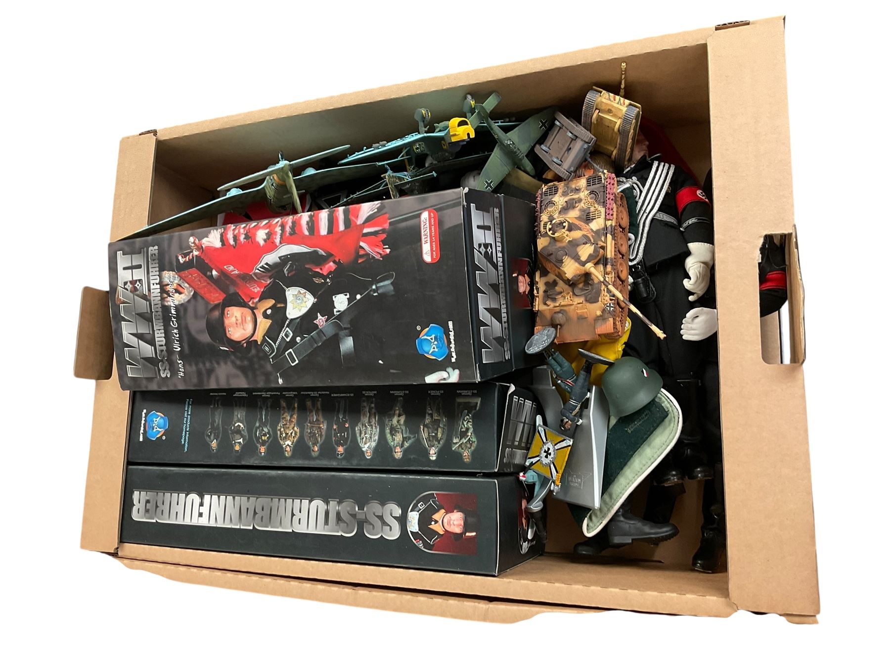 Collection of replica German WWII items, including solider figures, street sign etc, in three boxes 