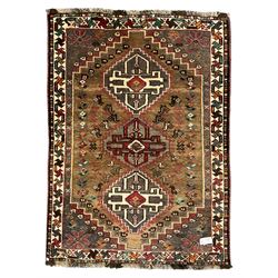 Small Iranian green and brown ground rug