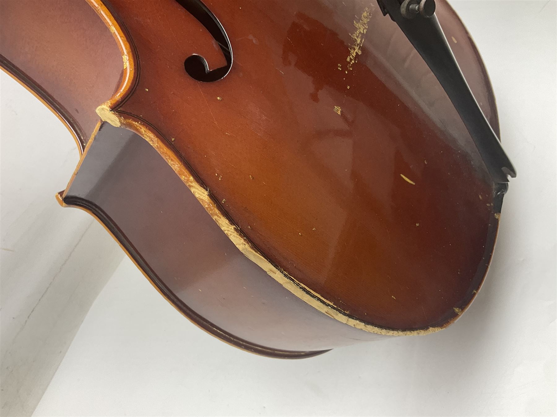 Two student half-size cellos - Boosey & Hawkes Artia with 65cm one-piece back and spruce top; bears maker's label; L104cm overall; and Romanian with 65.5cm two-piece maple back and ribs and spruce top; bears label; L108.5cm overall; each in soft carrying case with two bows (2)