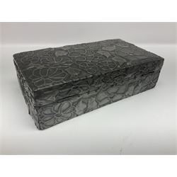 Liberty & Co Tudric pewter cigarette box, of plain rectangular form, with planished decoration to the slightly domed cover, opening to reveal a softwood interior, stamped Made in England 01234 Tudric Solkets beneath, together with another cigarette box, with applied pewter panels repousse decorated throughout with flower heads and leaves, with compartmentalised softwood interior, largest H5.5cm, W23cm