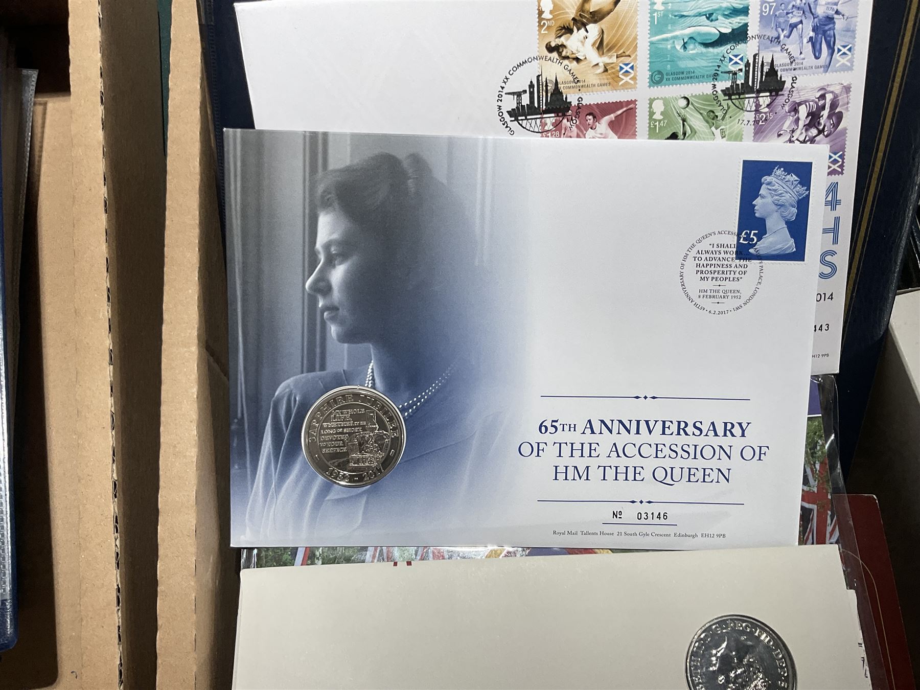 Approximately one hundred and fifteen Royal Mint coin covers, in two ring binder folders and loose, together with approximately 53 grams of Great British pre-1920 and approximately 68 grams of Great British pre-1947 silver threepence coins, and a small quantity of further pre-decimal coins