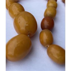 Amber bead necklace, single strand of graduating oval beads, the largest bead measuring approx 25mm x 20mm, the smallest measuring approx 10mm x 7mm