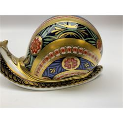 Three Royal Crown Derby paperweights, Garden Snail, with gold stopper, Farmyard Cockerel, with gold stopper and Carolina Duck, with gold stopper, all with printed mark beneath 