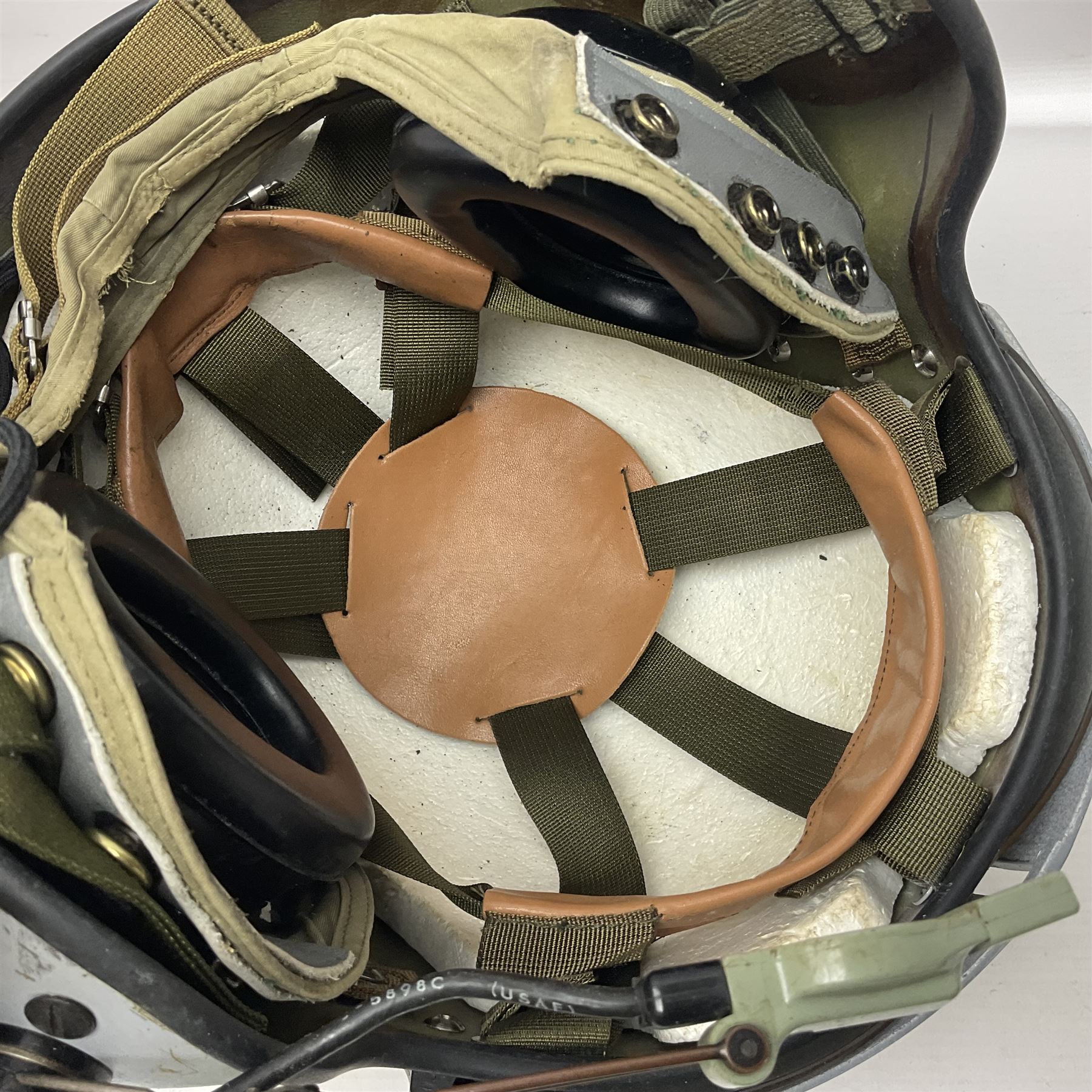 Silver grey SPH-4B Flight Helmet as used by helicopter pilots in the USAF and US Army in the 1990s; made of epoxy resin reinforced fibreglass; fitted with clear and tinted visors and complete with an M-87A/AIC boom mike; original condition and bench tested.