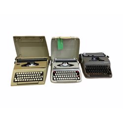 Three vintage typewriters to include Olympia, Smith-Corona Calypso and Courier, two portable with carry cases (3)