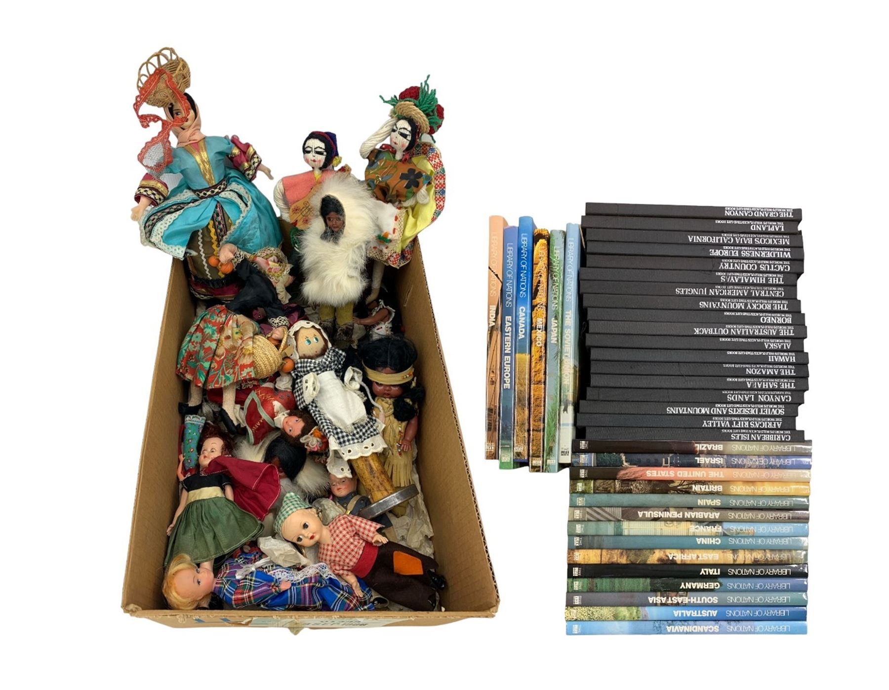 Collection of Time Life books comprising 'Library of Nations' and 'The World's Wild Places' (38) and various souvenir dolls in two boxes