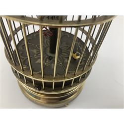 Automation bird cage of predominantly brass construction with central rotating orb and bird with painted and feathered decoration, H15cm