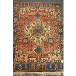  Persian red ground rug, blue border, 132cm x 185cm  