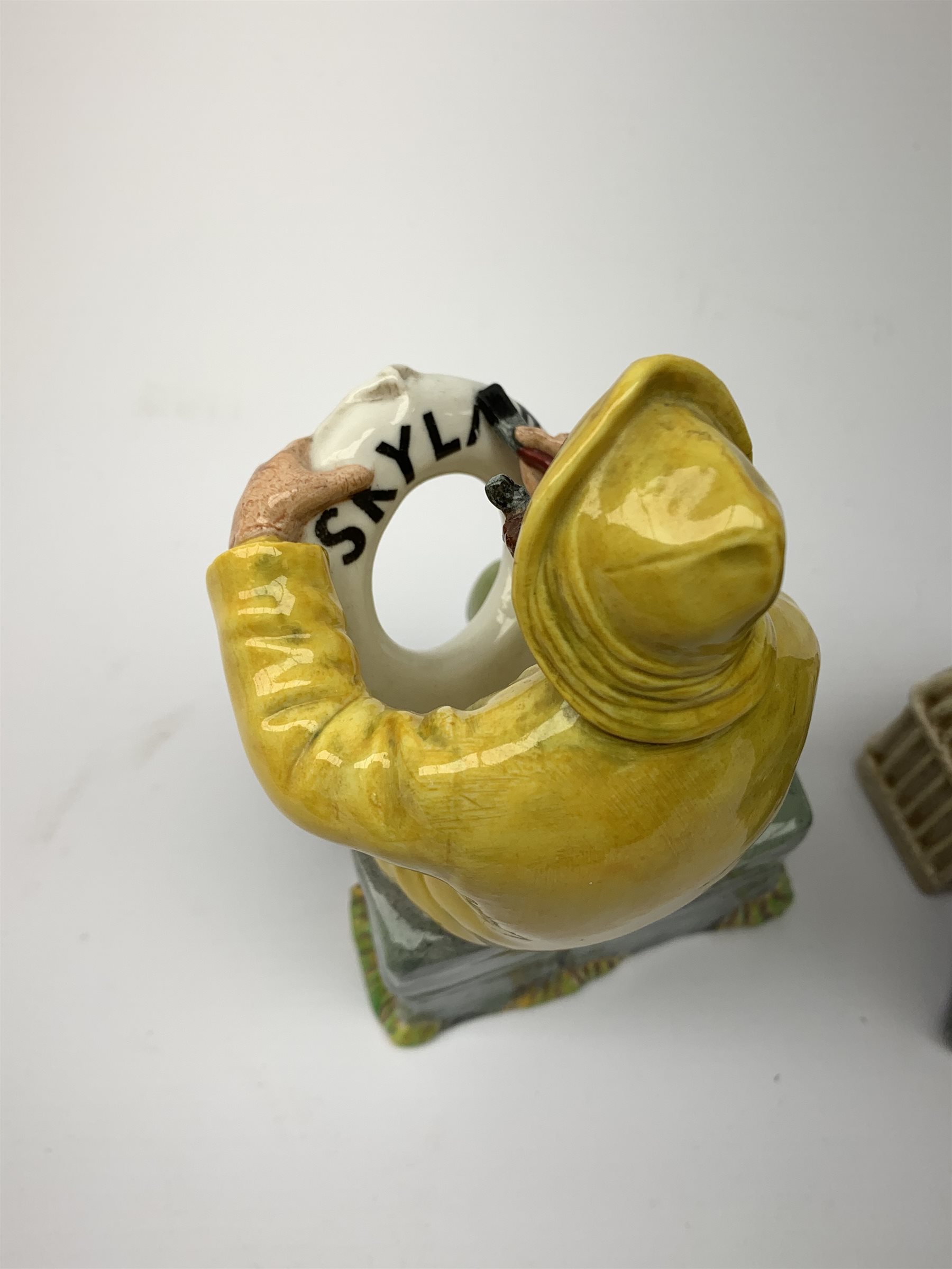 Two Royal Doulton figurines,  The Boatman HN2417, and Shore Leave HN2254, each with green printed mark beneath.