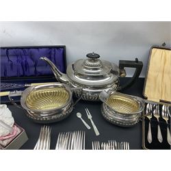 Mother of Pearl handled cutlery, with silver ferrules, comprising six fish knives and forks and six fruit knives and forks, the ferrules hallmarked Yates Brothers, Sheffield 1905, together with silver plated Edwardian three piece tea service and other flatware 