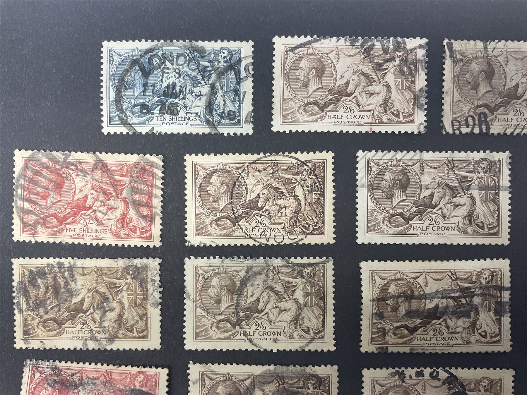 Great Britain King George V seahorse stamps, comprising fourteen half crown, seven five shillings and two ten shillings, all used, all previously mounted