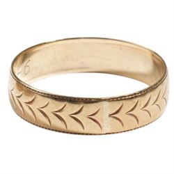 Two 9ct wedding bands, with engraved decoration
