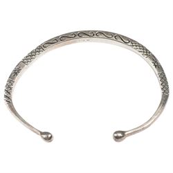 Silver torque bangle and a silver Chamilla charm bracelet 