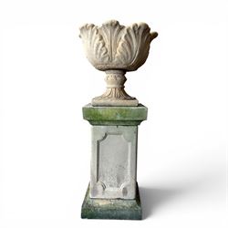 Cast stone five sectional urn on plinth, squat leaf and petal design urn on square base