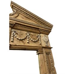Large Adams design pine frame mirror, sloped broken arch pediment with central acanthus leaf carving, the frieze decorated with bell flower garlands and central kylix vase motif, large plain mirror plate flanked by panelled sides with egg and dart mouldings and reeded slip mouldings, on plinth base
