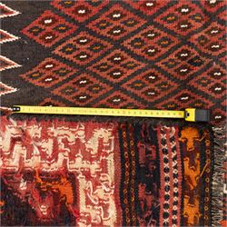 North west Persian Yamut Kilim, madder field with all-over lozenge lattice and serrated edges, with stepped end-panels and bold geometric borders in red, ivory and black