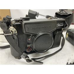 Quantity of cameras and accessories to include Olympus Trip 35, Minolta A f-EII 35mm, Yashica Auto Focus camera, Hanimex 35mm af camera in case, Kodak No.2A Folding Pocket Brownie camera in case, Minolta VLT-501 lens, etc