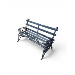 Coalbrookdale - rare pair of wrought iron and slatted wood garden benches, the twin wrought iron strapwork bench-ends formed of four scrolls over splayed feet, number 77 in the Coalbrookdale Castings Catalogue (see illustration)