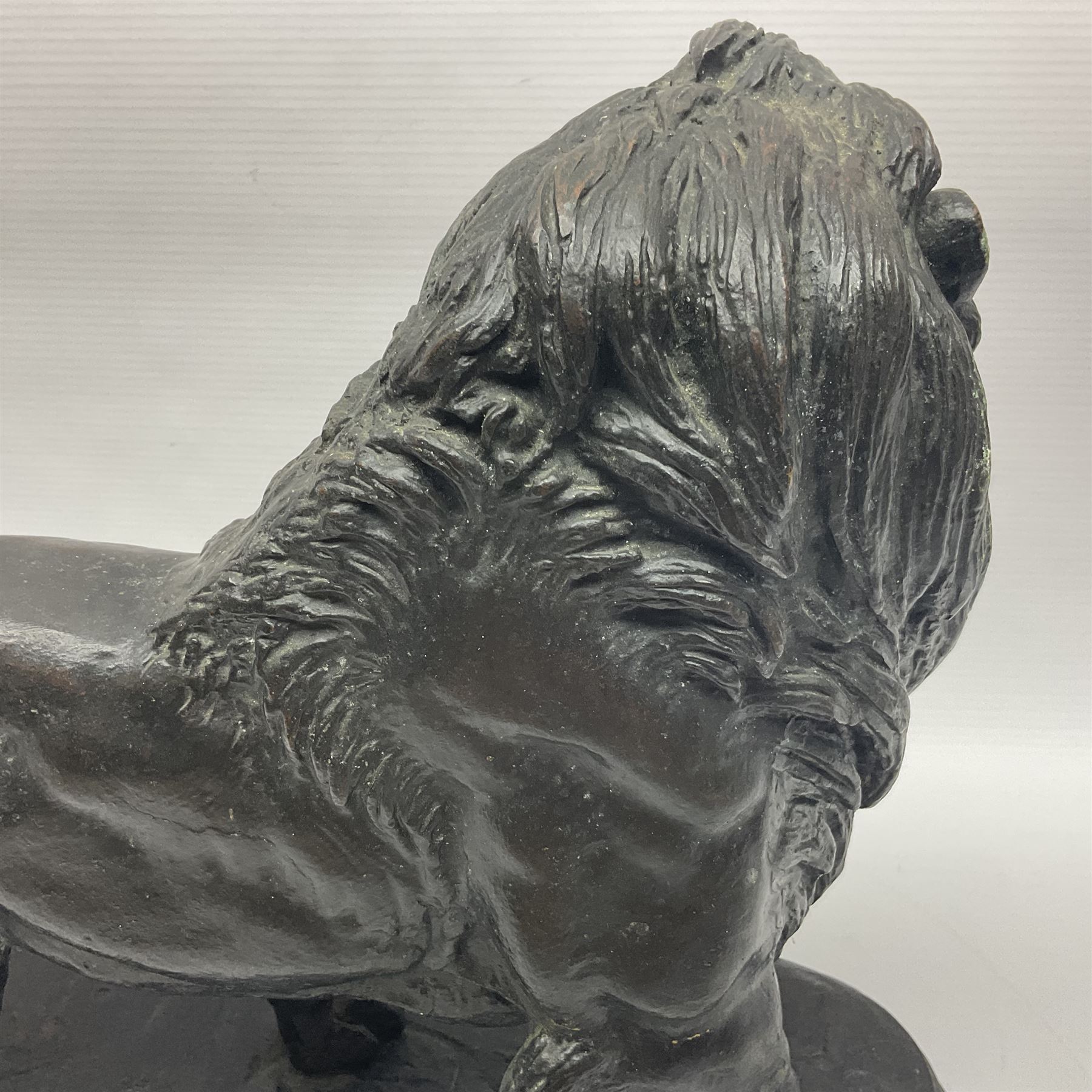 After Paul Edouard Delabrierre (French, 1829-1912), bronze, model of a lion, upon an oval base, signed E Delabrierre, overall H29.5cm, L46cm