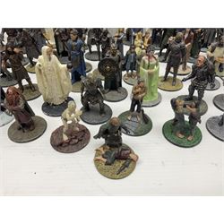 Approximately 80 NLP Lord of the Rings heavy metal painted figurines to include Fell Beast, boxed, and The Watcher, The Dark Lord Sauron, Treebeard etc, and unassociated Dracula themed composite figures marked HHFT50 