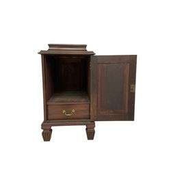 Regency style mahogany pedestal cabinet, sarcophagus top over single door enclosing drawer, the sides inlaid with star motifs, on square tapering lobe carved feet