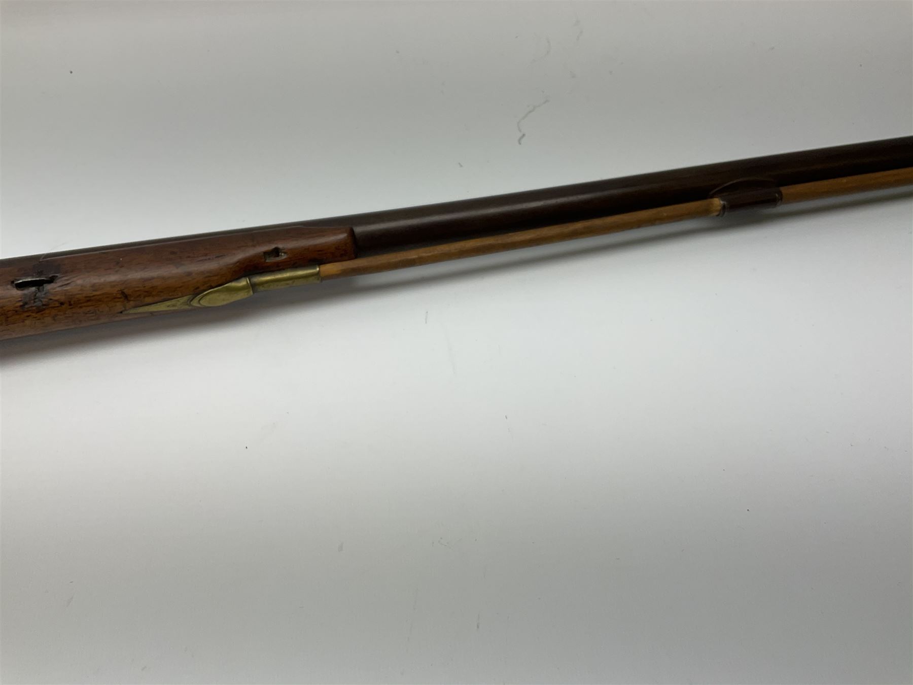 Early 19th century 15-bore flintlock converted to percussion cap fowling piece, the lock stamped T. Richards, walnut half stock with brass fittings including trigger guard with pineapple finial and 91cm barrel with ramrod under L129cm overall