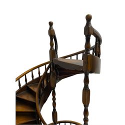 Miniature fruitwood spiral staircase, turned newel posts and balusters, rounded handrail, on circular moulded base