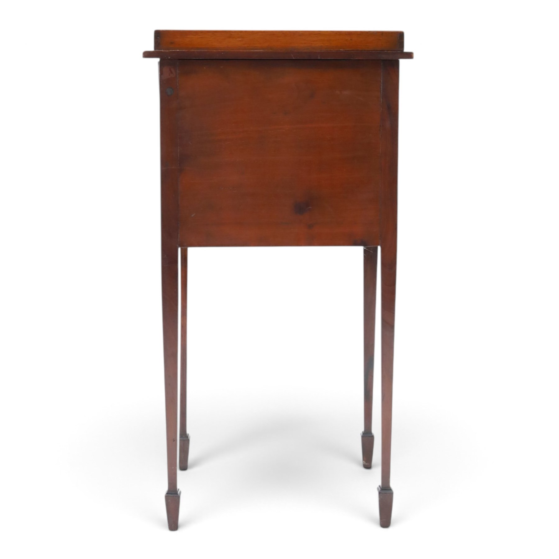 Edwardian mahogany pot cupboard, with three quarter galleried top, single cupboard door, raised on square tapering supports terminating in spade feet