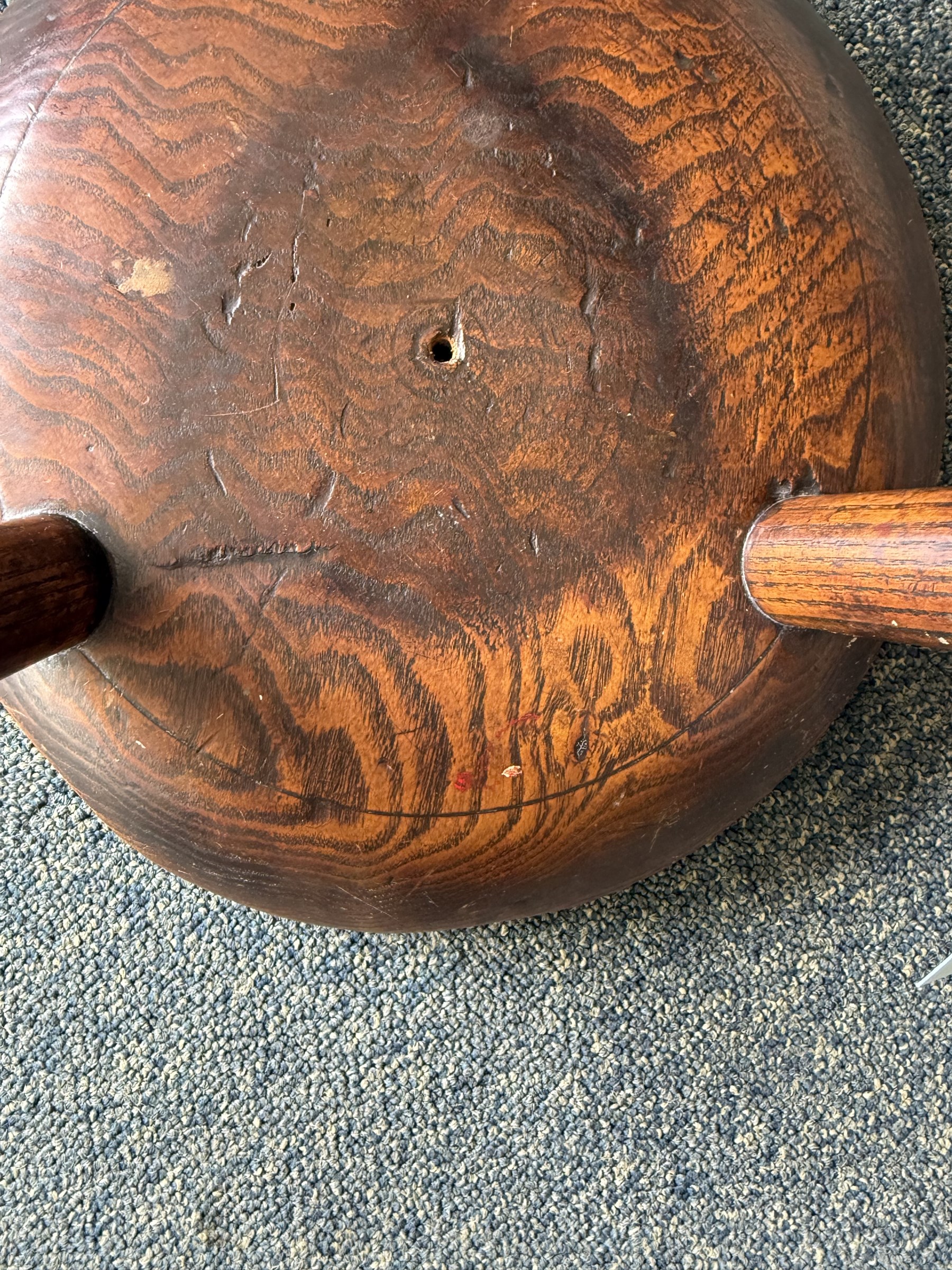 18th century ash and elm milking stool, circular figured top raised on cylindrical supports
