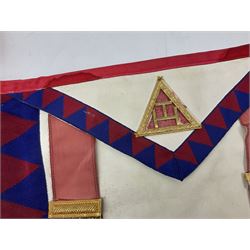 Two Masonic kid leather aprons, one with sash and cuffs, the other with sash, each marked 'Yorkshire North and East Ridings'; and three other unmarked Masonic aprons with sashes