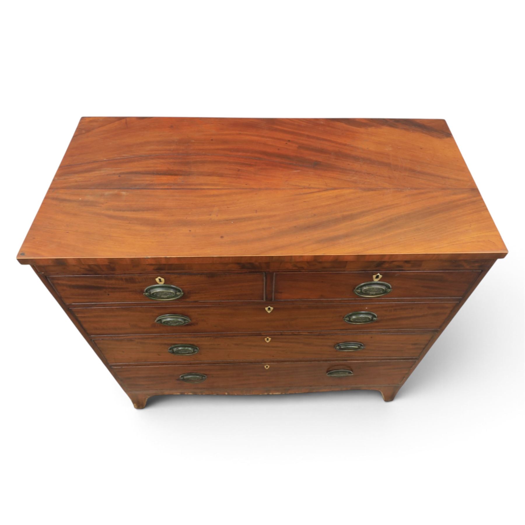 19th century mahogany chest, two short over three long drawers with brass handles, raised on shaped feet