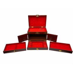 Chinese hardwood jewellery box mounted with engraved brass fixtures, the two exterior doors revealing three drawers below the hinged upper lid, lined with red material decorated with floral sprays, H25cm, W36cm, D23cm