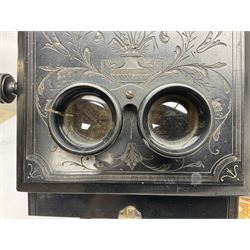 Victorian tabletop stereoscope/postcard viewer of ebonised oblong form, with carved foliate detail, together with a hand help stereoscope and a collection of slides and postcards, when open tabletop stereoscope H61cm
