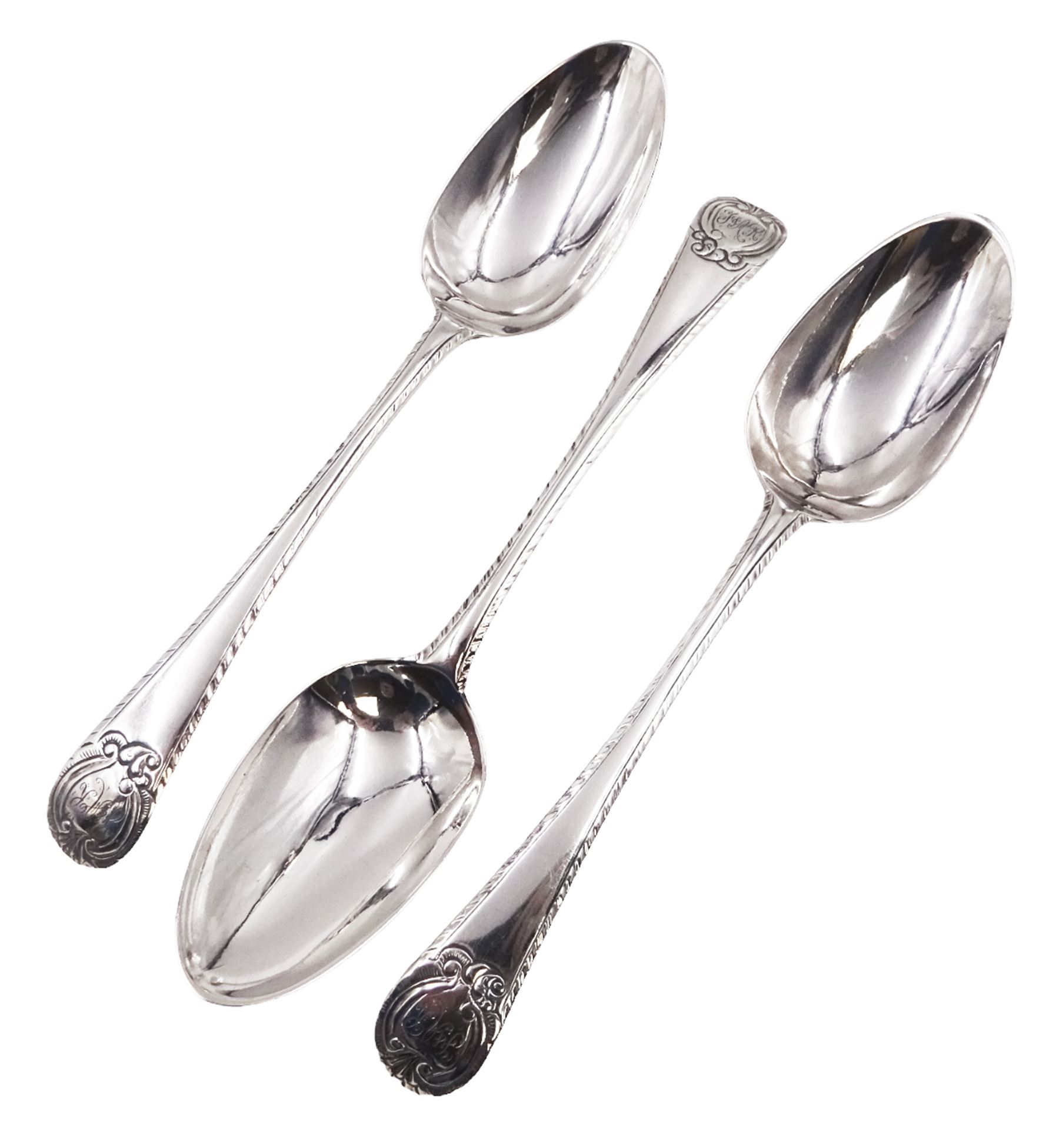 Set of three George III silver Old English pattern table spoons, each engraved with monogram to terminal and with dart border to handle, hallmarked London circa 1770, maker's mark GS, hallmarks worn and partially indisitinct