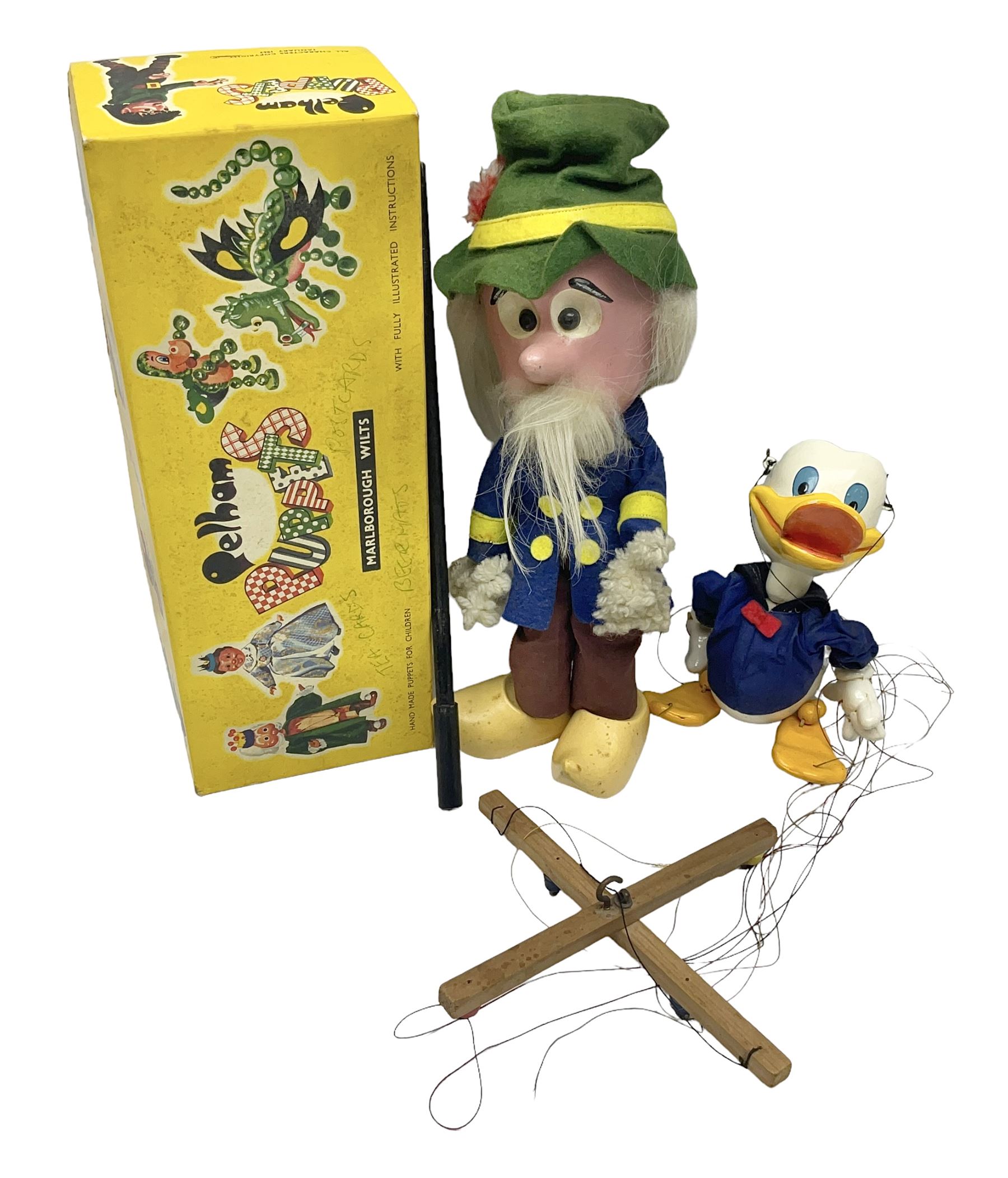 Two Pelham Puppets - The Magic Roundabout Mr. Rusty pole puppet with wool hands and blue  coat dated 1963; boxed; and Type SL Disney Donald Duck; unboxed (2)