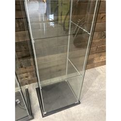 Three Ikea rosewood finish illuminated four glass shop display cabinets, with shelves and keys