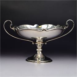 Art Nouveau silver twin handled pedestal dish, the bowl of circular form with shaped rim a...