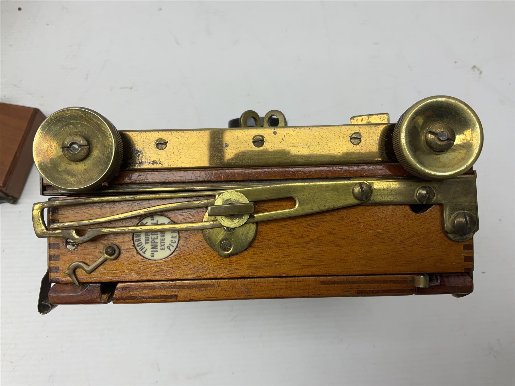 Sands Hunter & Co Ltd folding 1/4 plate camera in mahogany and lacquered brass, with two lenses and leather case