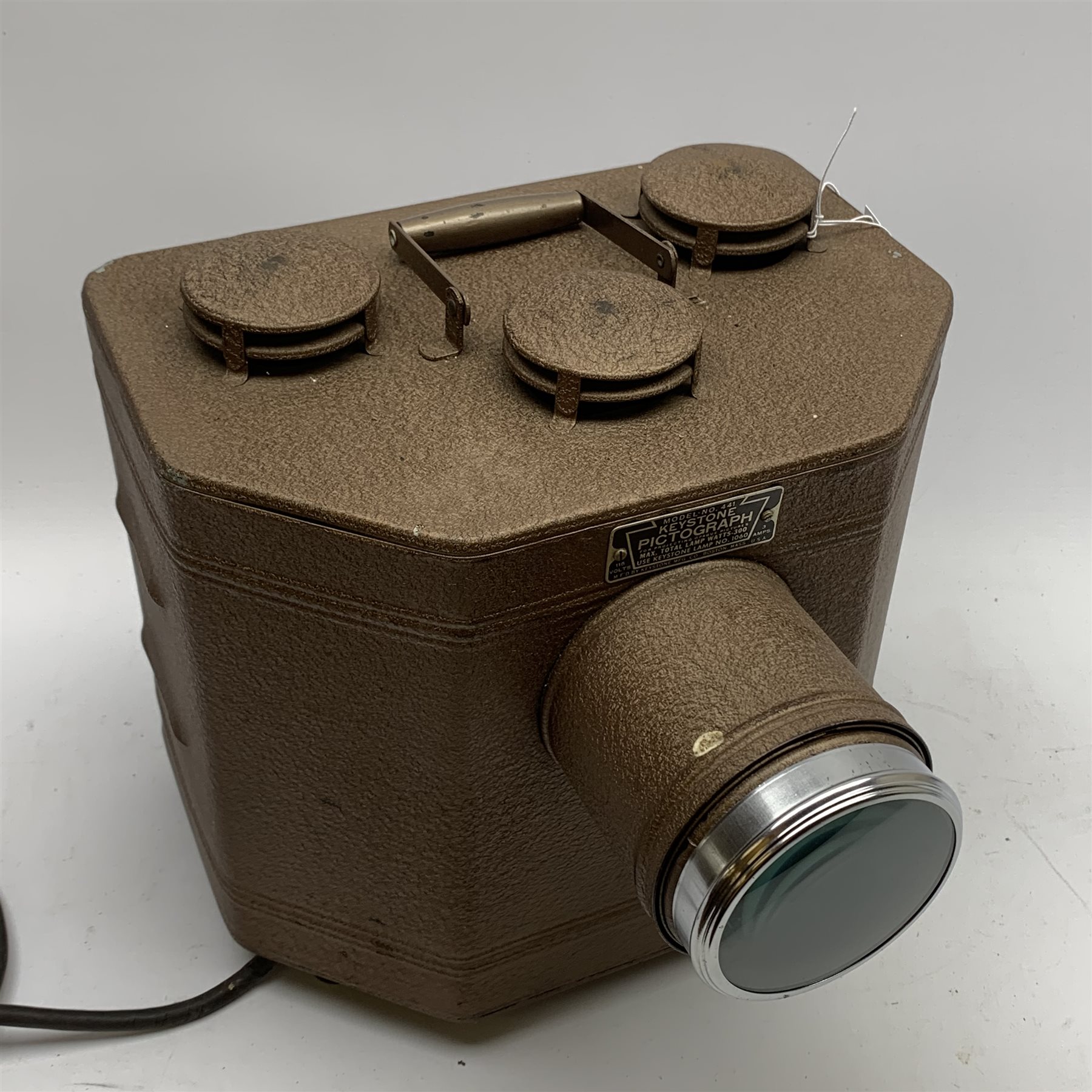 Keystone Pictograph Model No.441 Epidiascope, the trapezium shaped tin case with brown crackled finish, W30cm H28cm