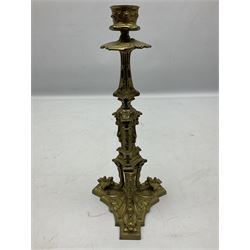 Pair of 19th century gilded candlesticks, the column depicting seated putti, raised on triform base, H27.5cm
